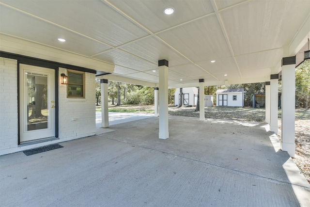 view of patio featuring a storage shed