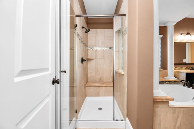 bathroom with independent shower and bath and ornate columns