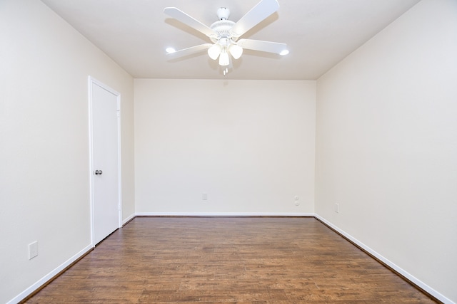 unfurnished room featuring ceiling fan and dark hardwood / wood-style floors