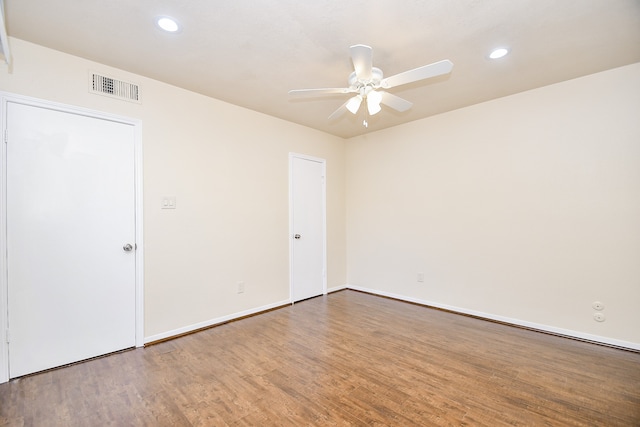 unfurnished room with hardwood / wood-style flooring and ceiling fan