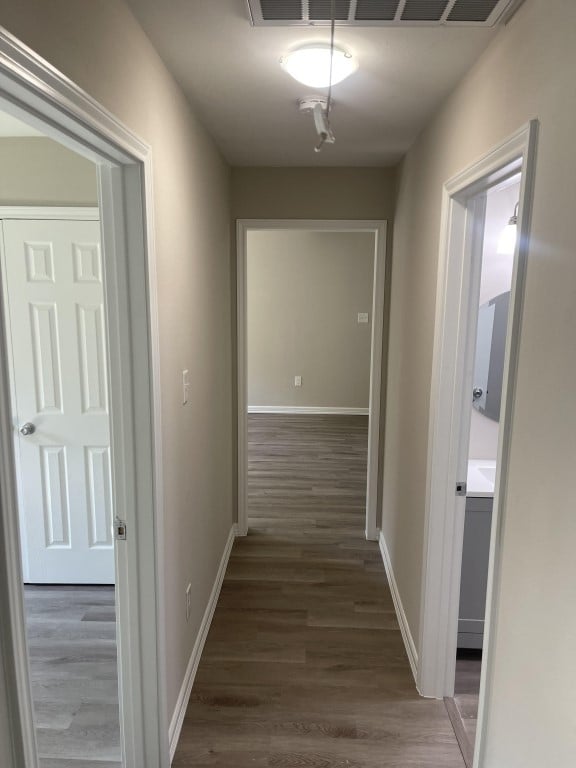 hall featuring dark wood-type flooring