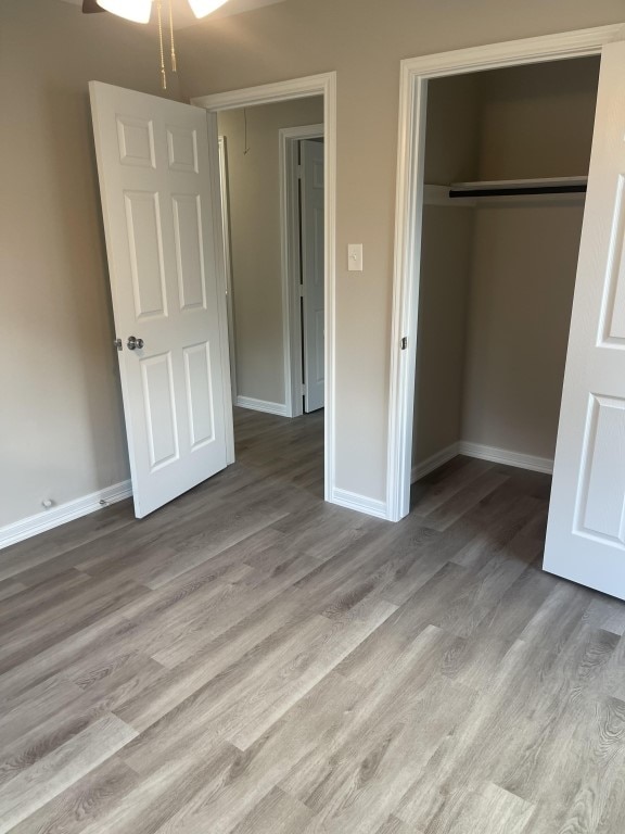 unfurnished bedroom featuring light hardwood / wood-style floors and a closet