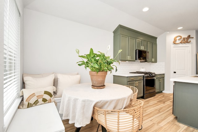 dining space featuring light wood-type flooring