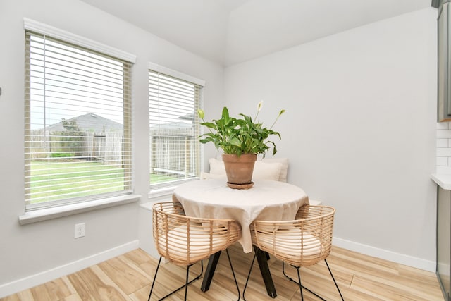 dining space featuring light wood-type flooring