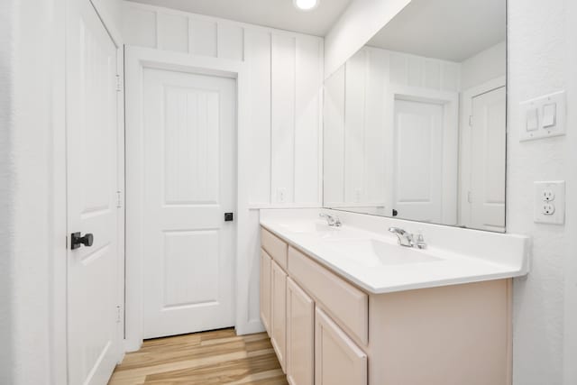 bathroom with wood-type flooring and vanity