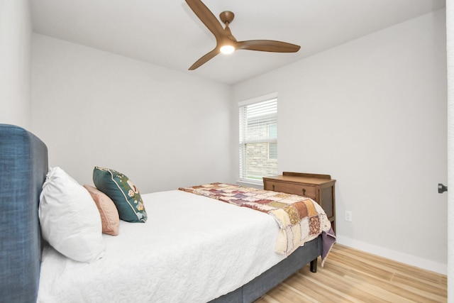 bedroom featuring hardwood / wood-style flooring and ceiling fan