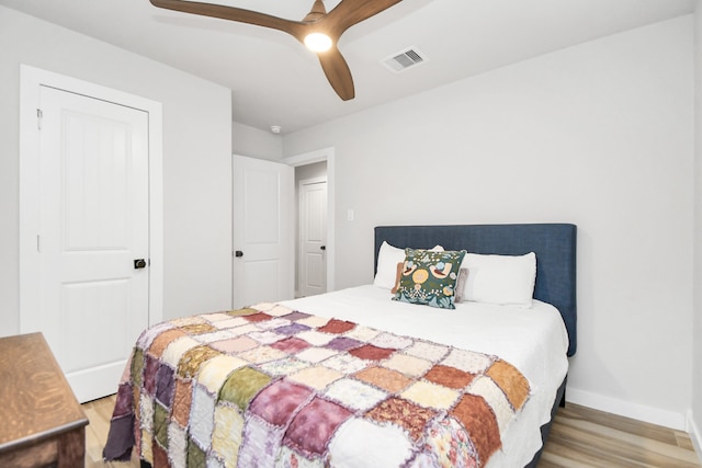 bedroom featuring light wood-type flooring and ceiling fan