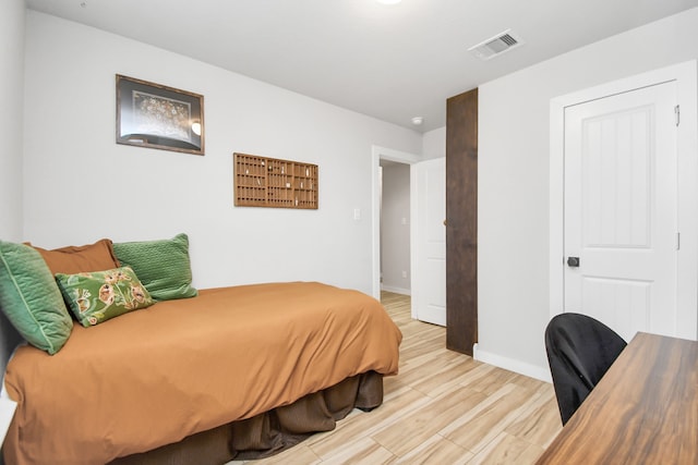 bedroom featuring light wood-type flooring