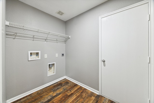 clothes washing area featuring dark wood-type flooring, electric dryer hookup, and washer hookup