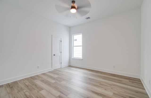 empty room with light hardwood / wood-style floors and ceiling fan