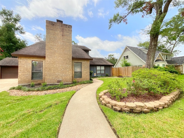 back of house featuring a lawn