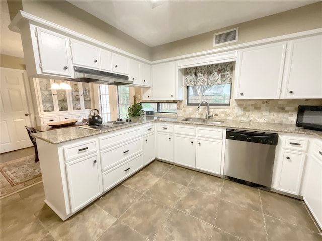 kitchen featuring appliances with stainless steel finishes, white cabinetry, sink, and light stone counters