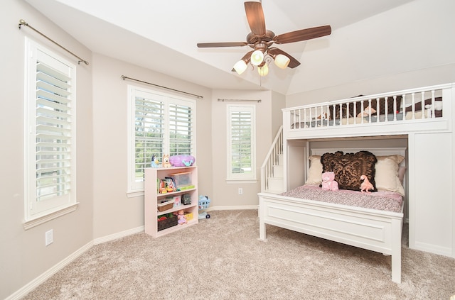 bedroom featuring lofted ceiling, light carpet, and ceiling fan