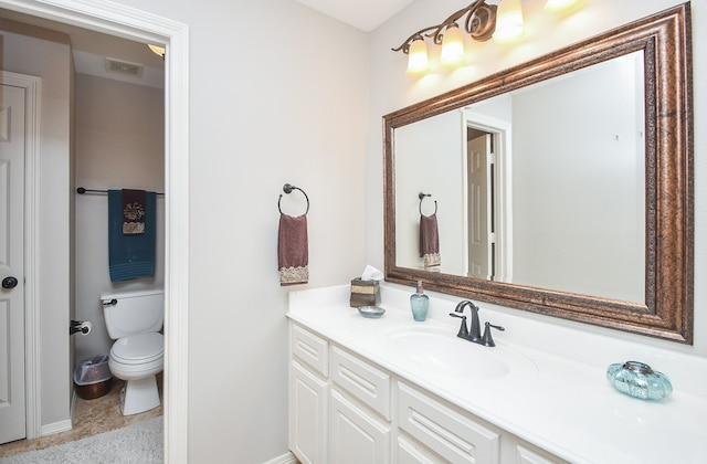 bathroom with vanity and toilet