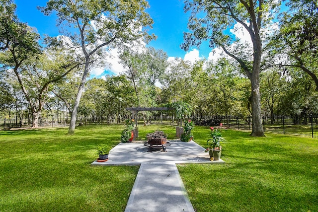 view of community with a patio area and a yard