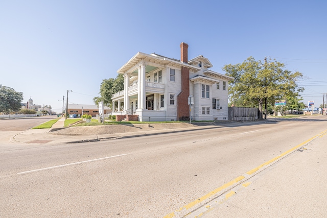 neoclassical / greek revival house with a balcony