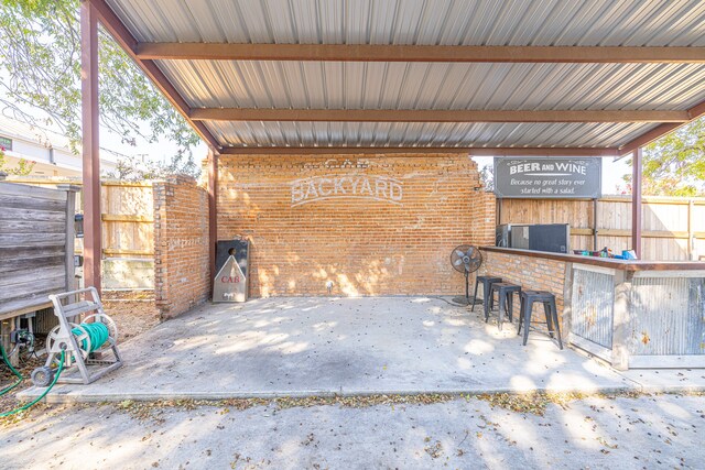 view of patio with an outdoor bar