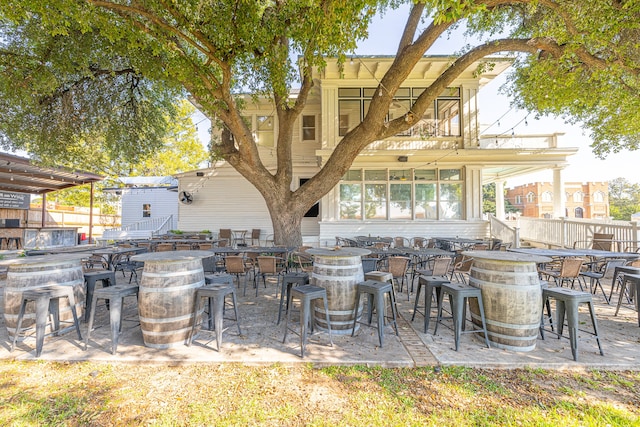 view of patio / terrace featuring an outdoor bar