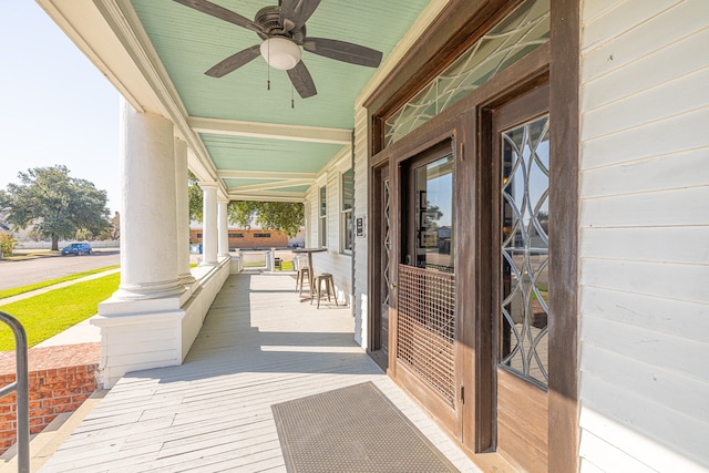 exterior space with a porch and ceiling fan