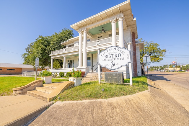 view of front of house featuring a balcony, covered porch, and ceiling fan