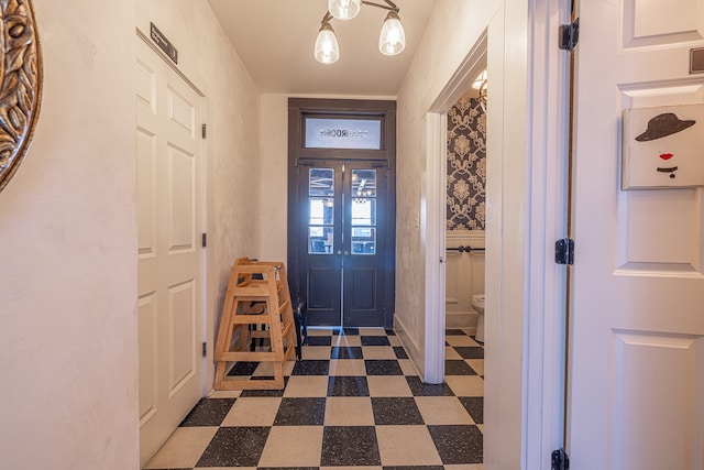 entrance foyer featuring a chandelier