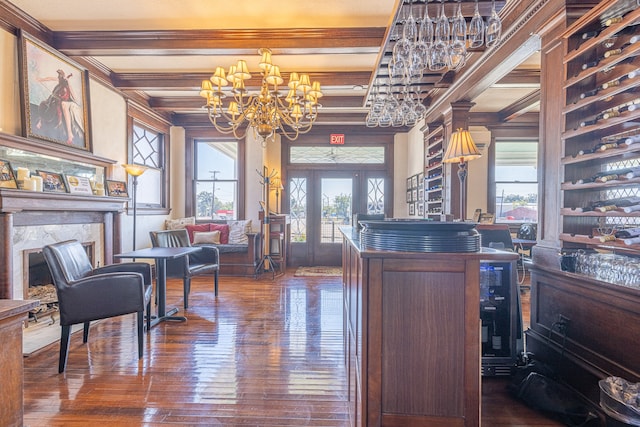 interior space featuring crown molding, beamed ceiling, dark hardwood / wood-style flooring, and a premium fireplace