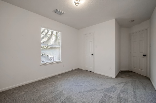 unfurnished bedroom with a closet and carpet