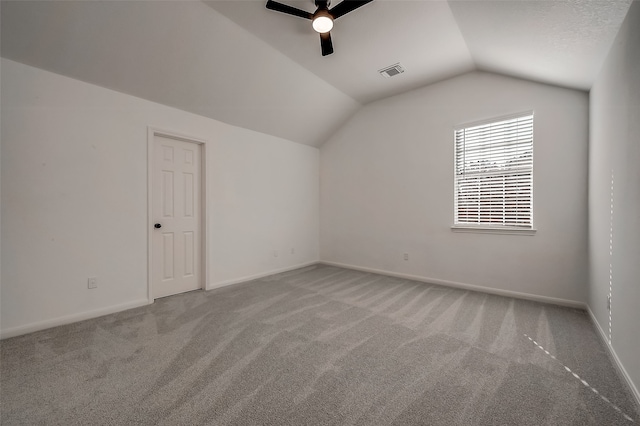 bonus room featuring ceiling fan, light colored carpet, and lofted ceiling