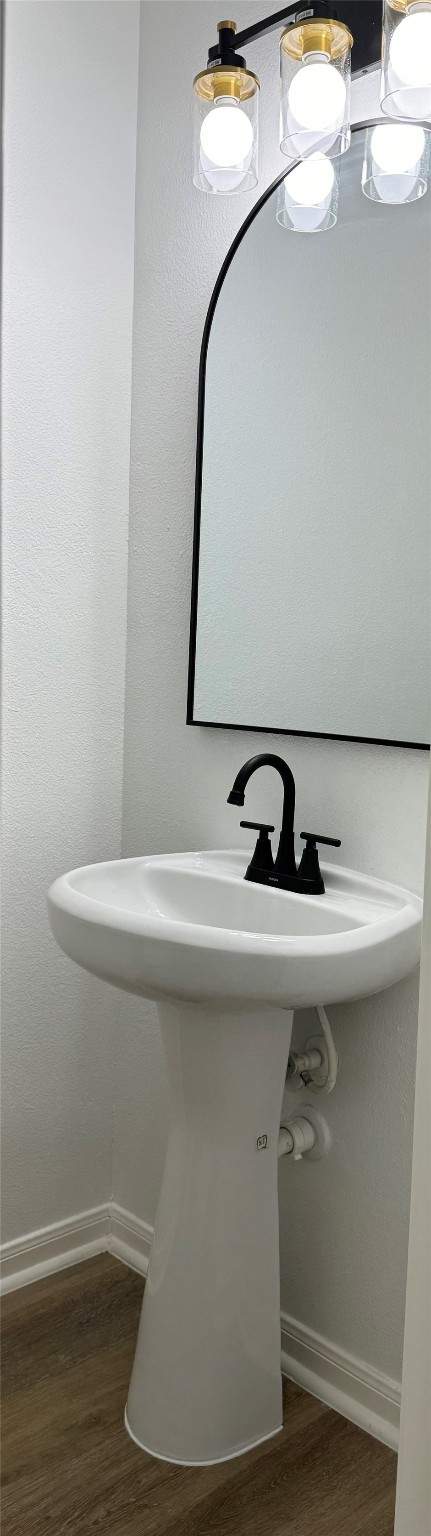 bathroom featuring wood-type flooring