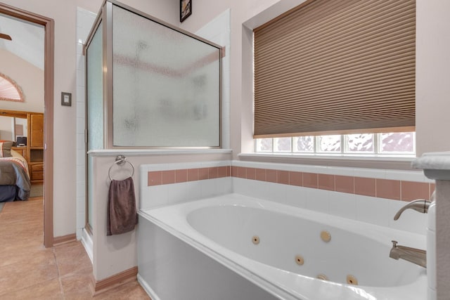 bathroom with tile patterned flooring and independent shower and bath