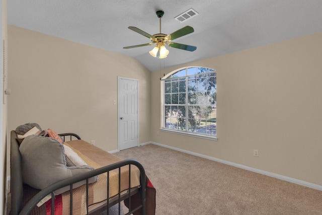 sitting room featuring ceiling fan, light colored carpet, and vaulted ceiling