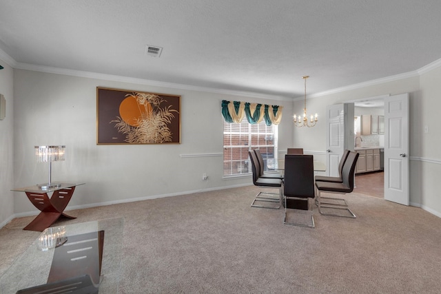 dining area featuring sink, light colored carpet, ornamental molding, and a notable chandelier