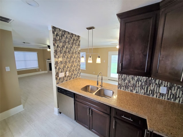 kitchen featuring sink, dishwasher, decorative light fixtures, and plenty of natural light