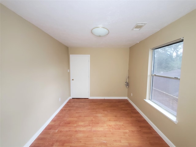 spare room featuring light hardwood / wood-style floors