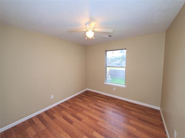 unfurnished room with wood-type flooring and ceiling fan