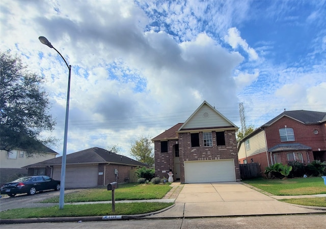 view of front of property featuring a garage and a front lawn