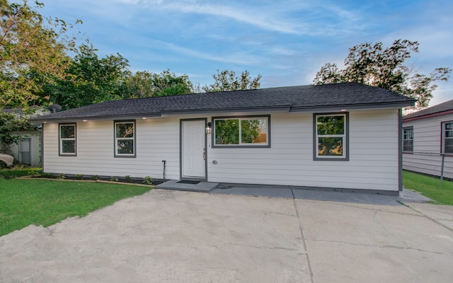 ranch-style house featuring a patio and a front yard