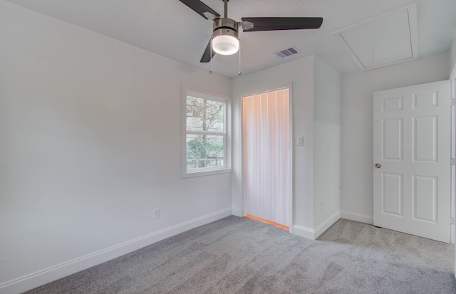 unfurnished bedroom with light carpet and ceiling fan