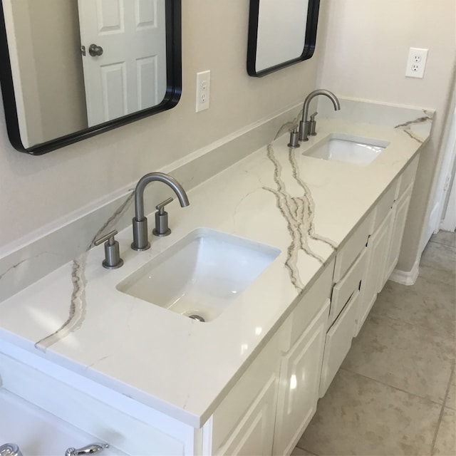 bathroom with vanity and tile patterned flooring