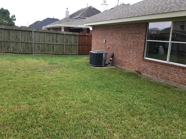 view of yard featuring central AC