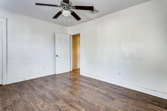 unfurnished room featuring ceiling fan and dark hardwood / wood-style flooring