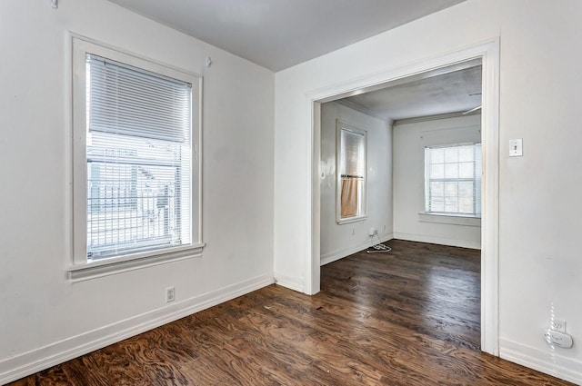 empty room featuring dark wood-type flooring