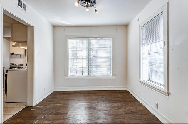 unfurnished dining area featuring dark hardwood / wood-style flooring