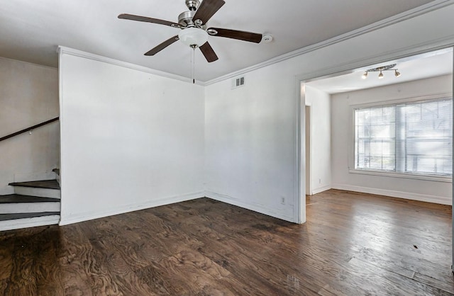 empty room with ceiling fan, crown molding, and dark wood-type flooring