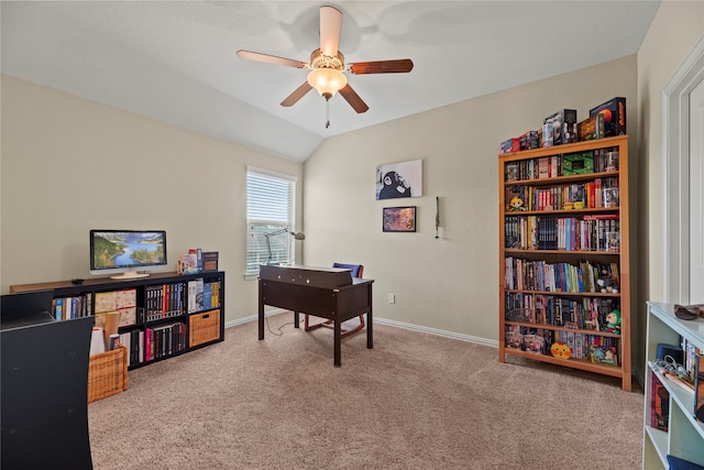 office area featuring ceiling fan, lofted ceiling, and light colored carpet