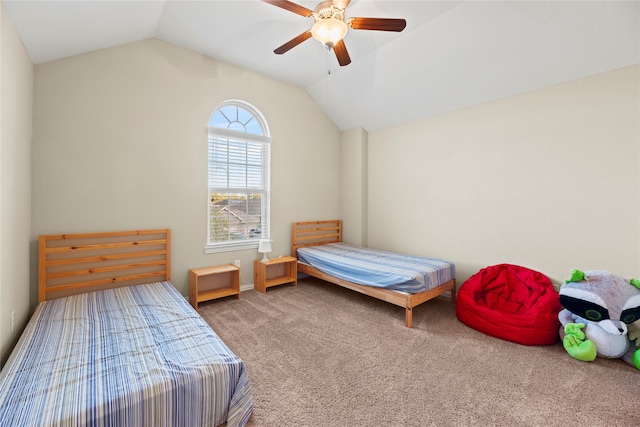 carpeted bedroom featuring ceiling fan and vaulted ceiling