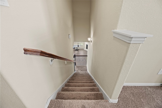 stairs featuring carpet