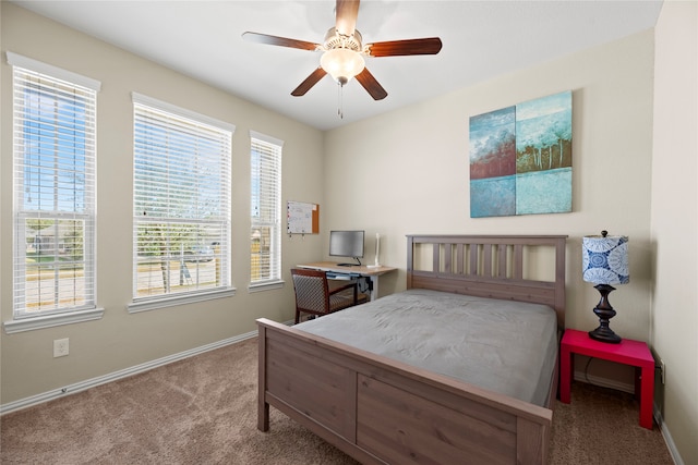 bedroom with ceiling fan and carpet