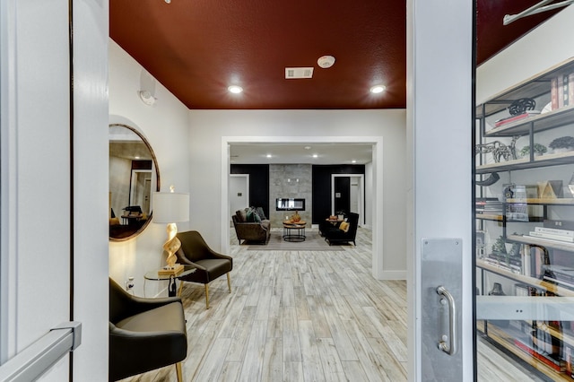 hall with light hardwood / wood-style flooring