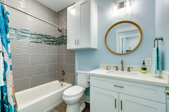 full bathroom with toilet, hardwood / wood-style flooring, shower / bath combo with shower curtain, and vanity